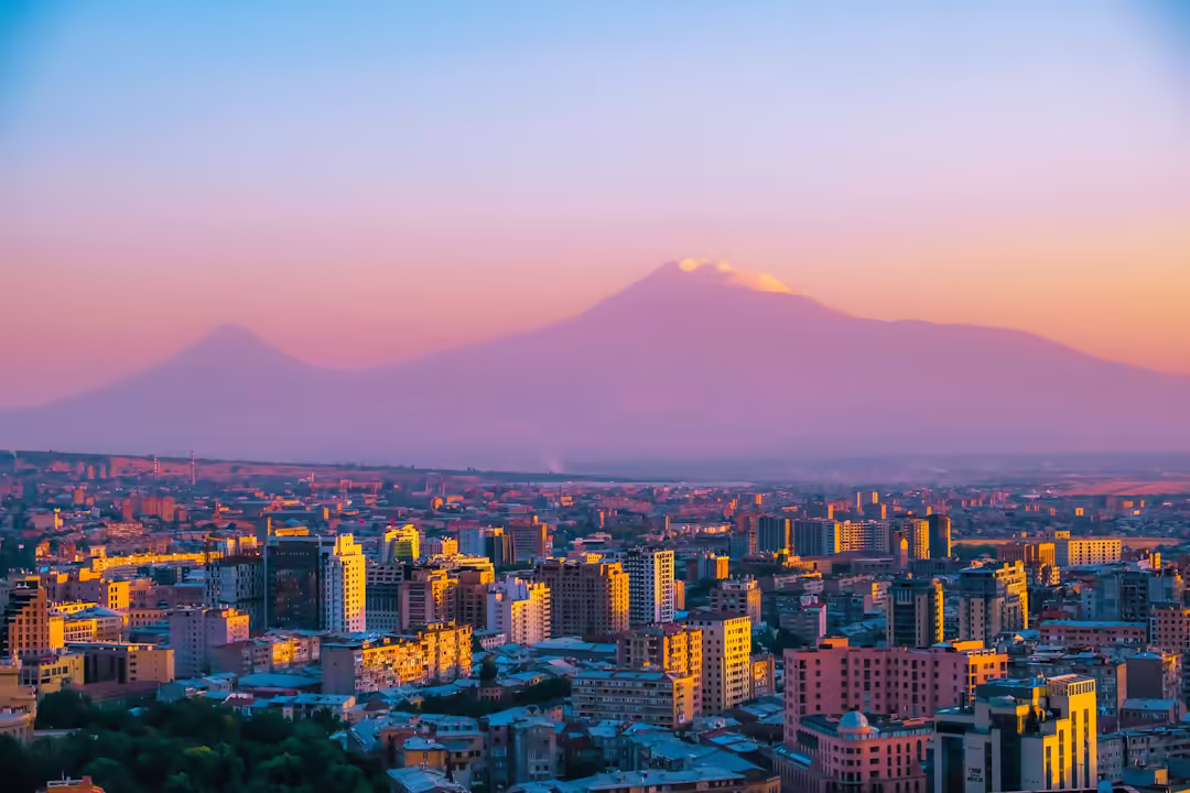 Yerevan at sunset with Mount Ararat rising behind the city skyline